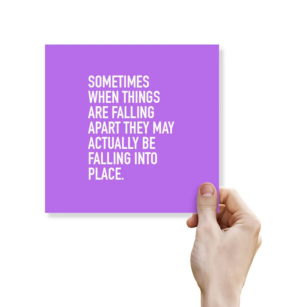 Inspirational greeting card with purple background and motivational quote held by hand