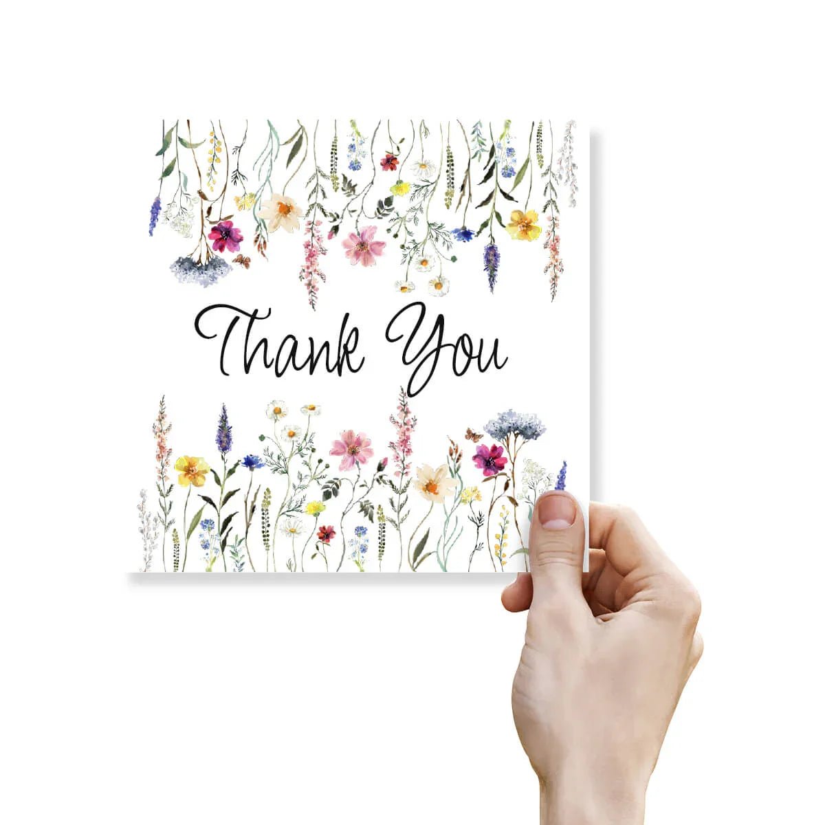 Hand holding thank you card with floral border and elegant script text