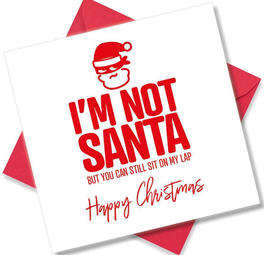 Funny Christmas greeting card with red text 'I'm not Santa but you can still sit on my lap' and a Santa face illustration.