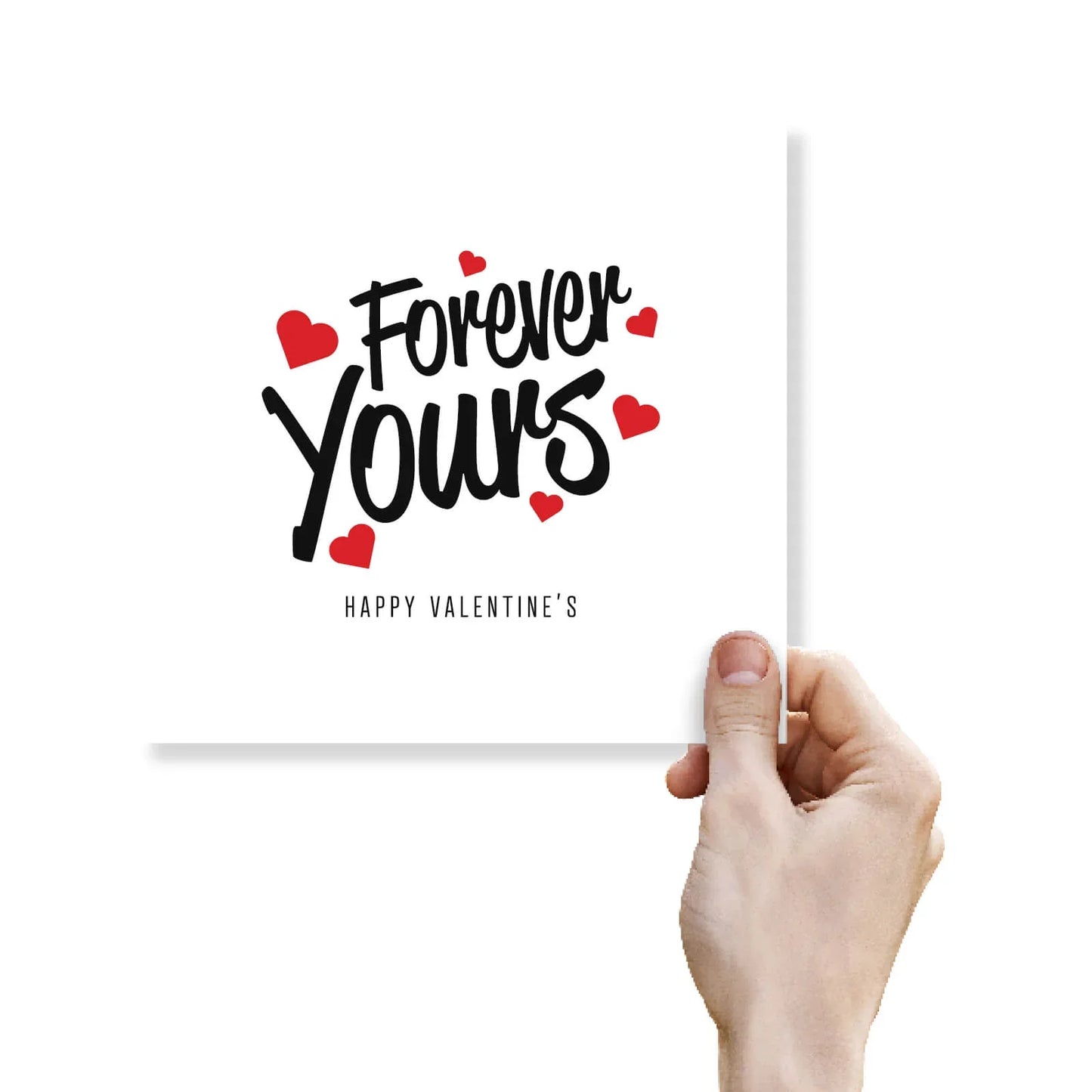 Hand holding a Valentine's Day card with 'Forever Yours' and red hearts on the cover.