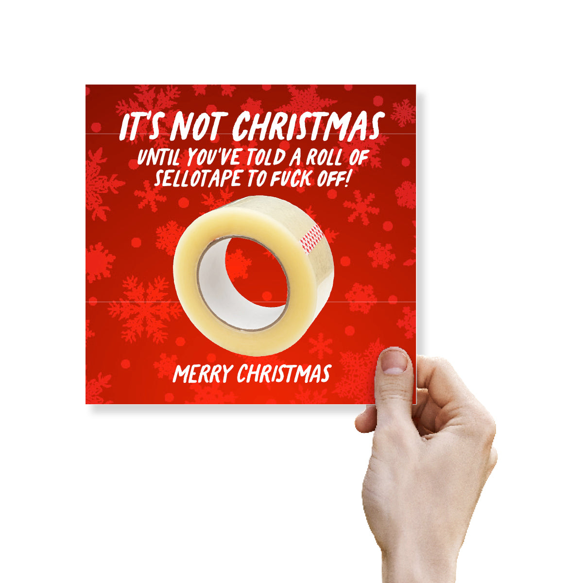 A hand holding a square red Christmas greeting card featuring a roll of clear tape on a red snowflake background with the text 'IT'S NOT CHRISTMAS UNTIL YOU'VE TOLD A ROLL OF SELLOTAPE TO FUCK OFF! MERRY CHRISTMAS'.