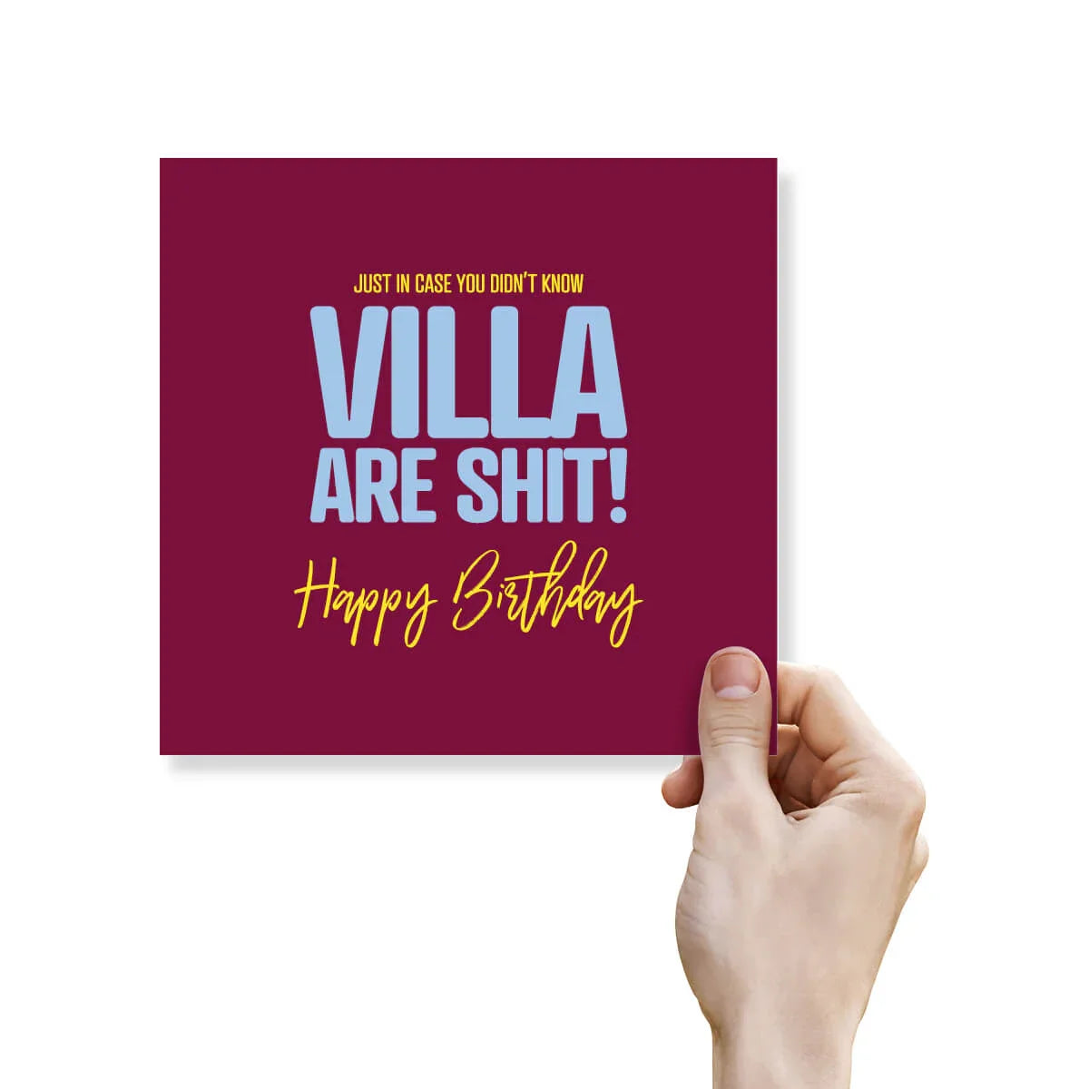 Funny rude birthday card with bold text mocking Aston Villa, held in hand on a white background.