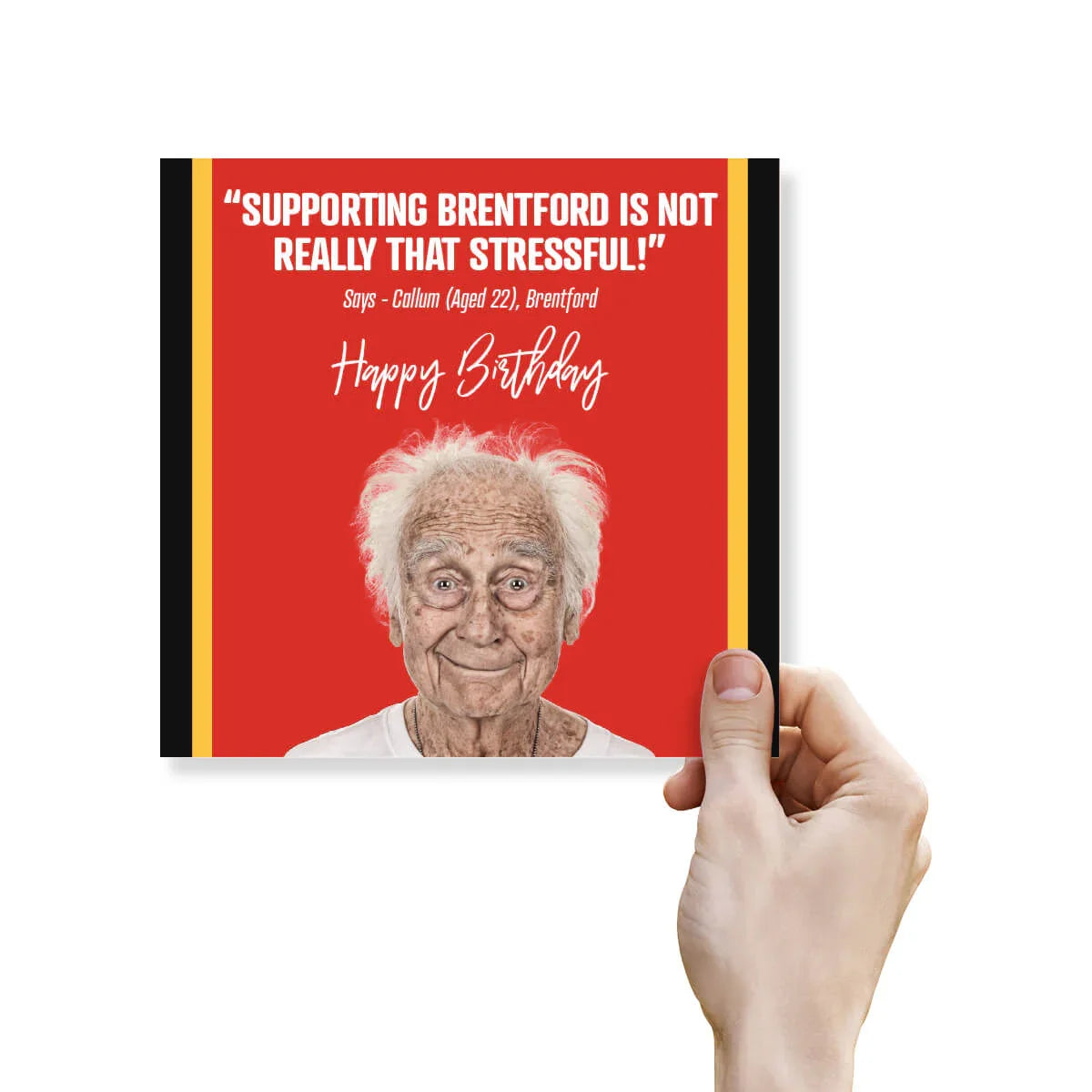 Hand holding a birthday card with a red background and text, featuring an elderly man's face.