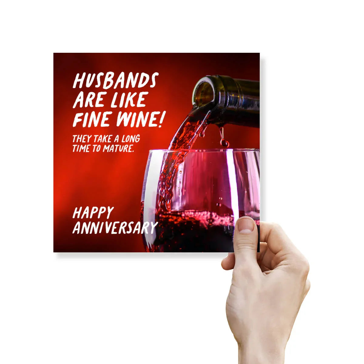 Funny anniversary card with wine pouring into a glass and the text 'Husbands are like fine wine, they take a long time to mature. Happy Anniversary.'