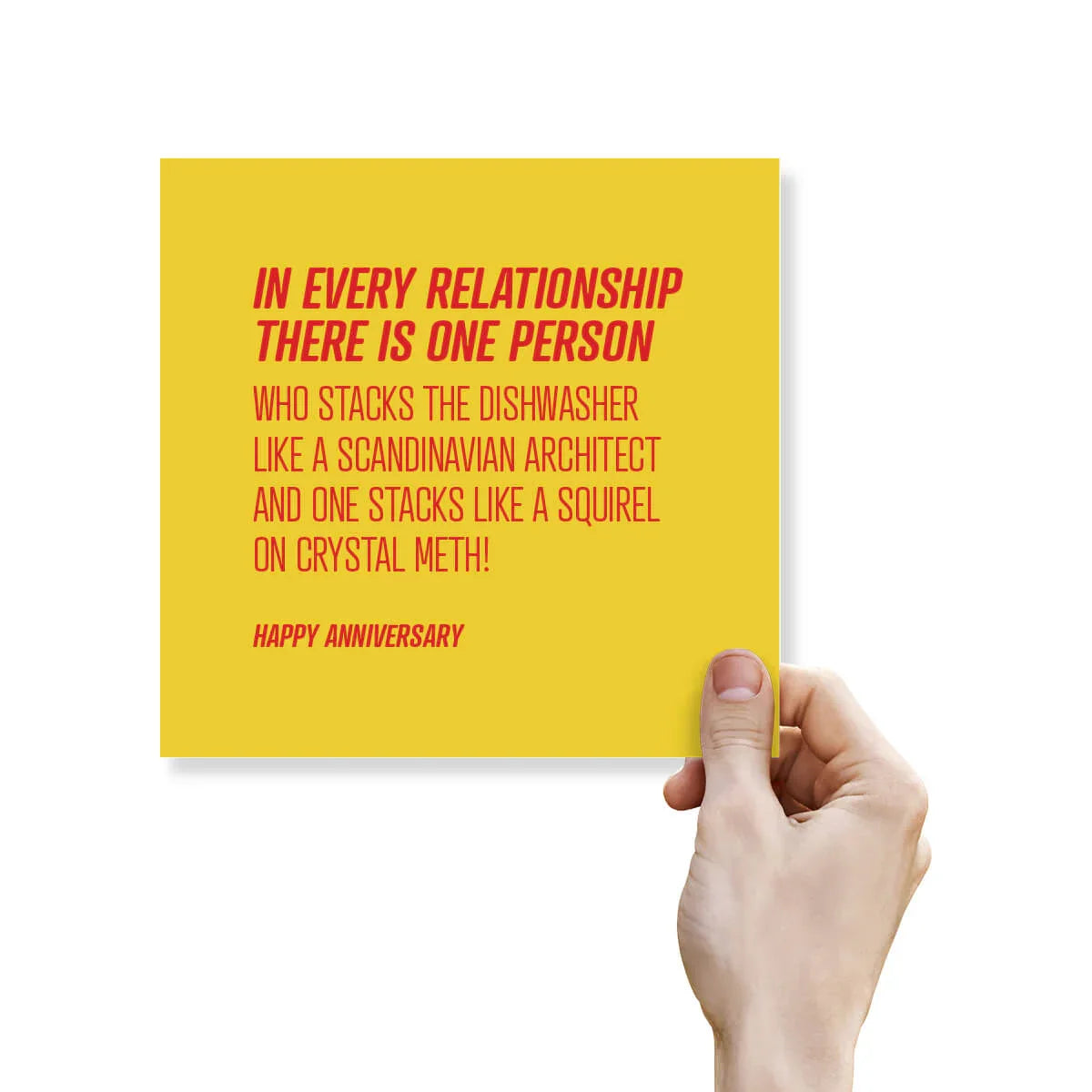 Funny anniversary card with yellow background and bold red text about dishwasher stacking, held by a hand.