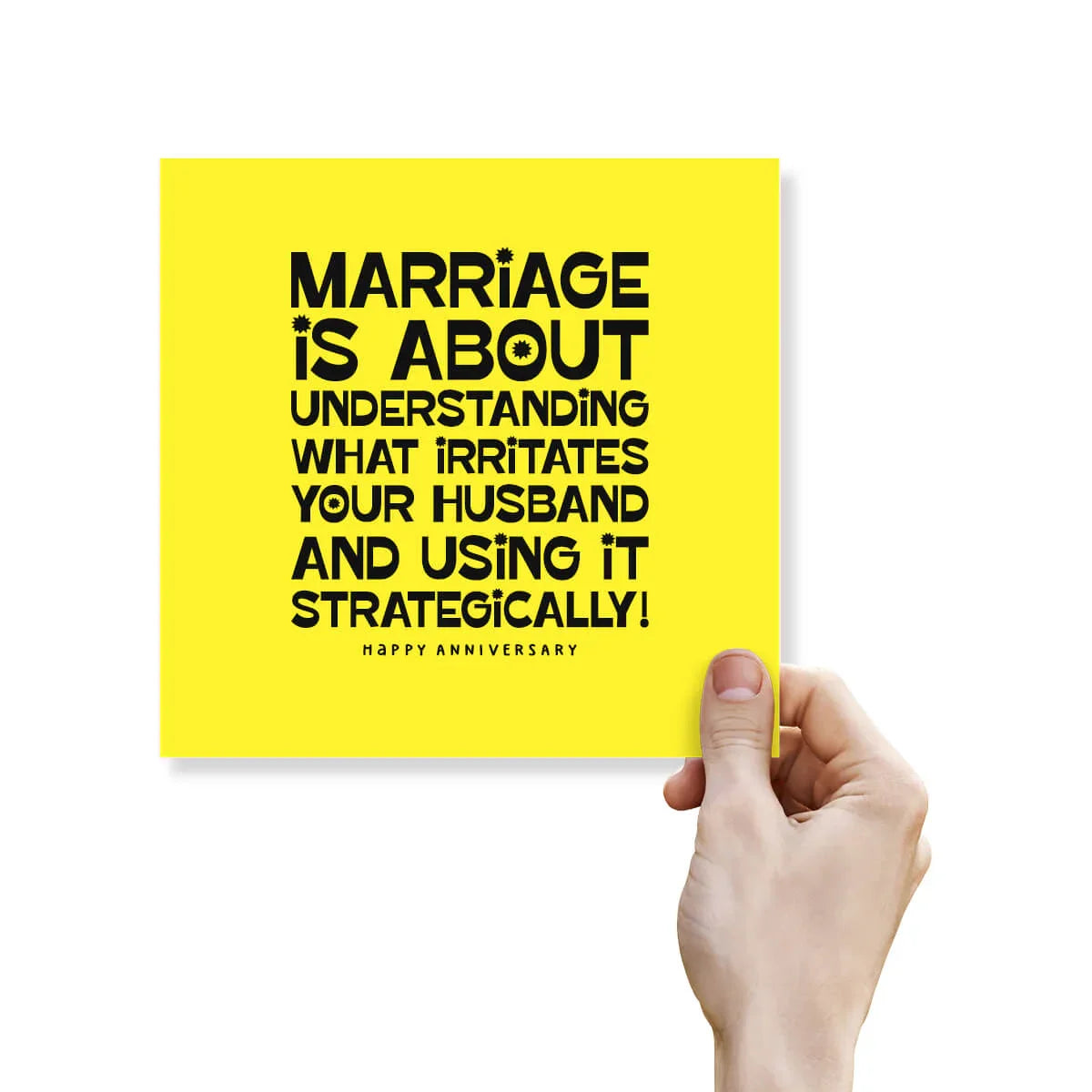Funny yellow anniversary card with bold black text and a hand holding it, humorous marriage joke