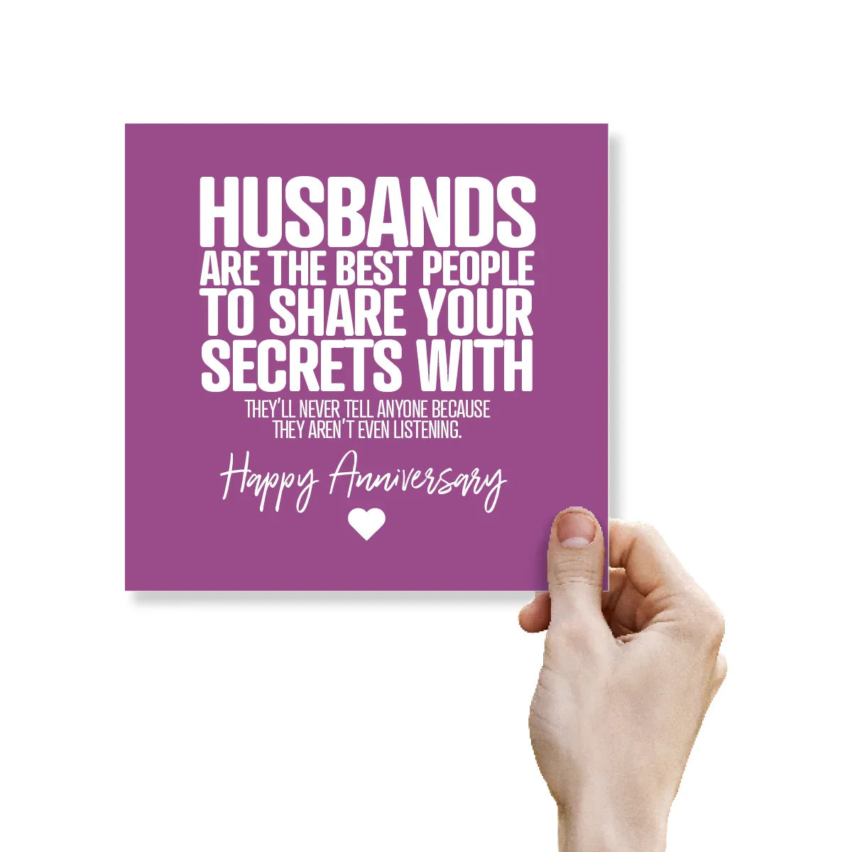 Purple card with humorous anniversary message held by a hand on a white background