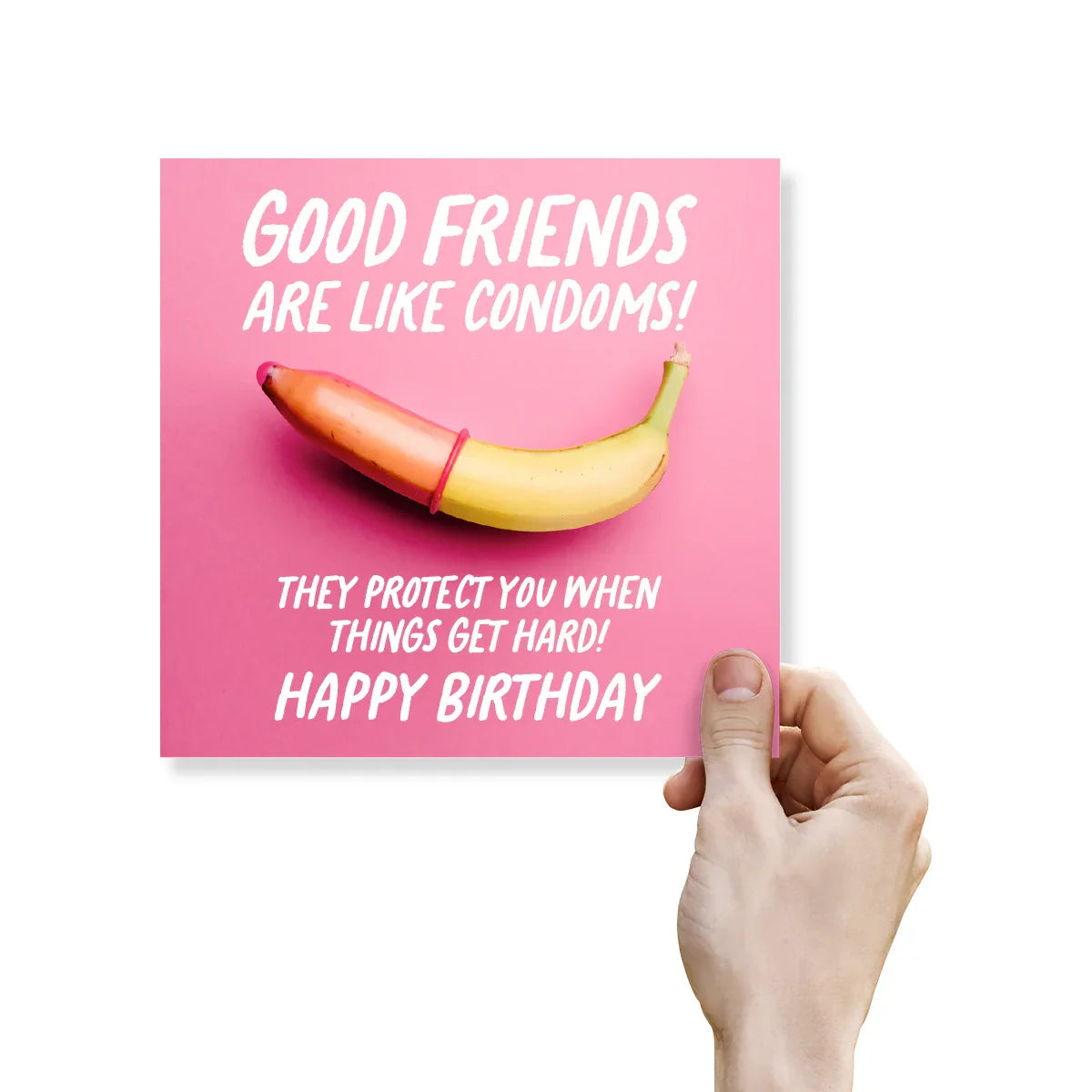 Birthday card with a banana and text on a pink background, held by a hand.