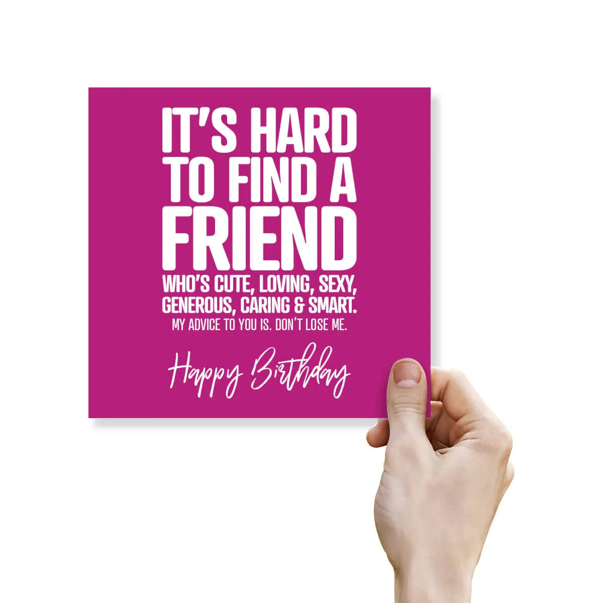 Hand holding a pink card with humorous birthday message on a white background