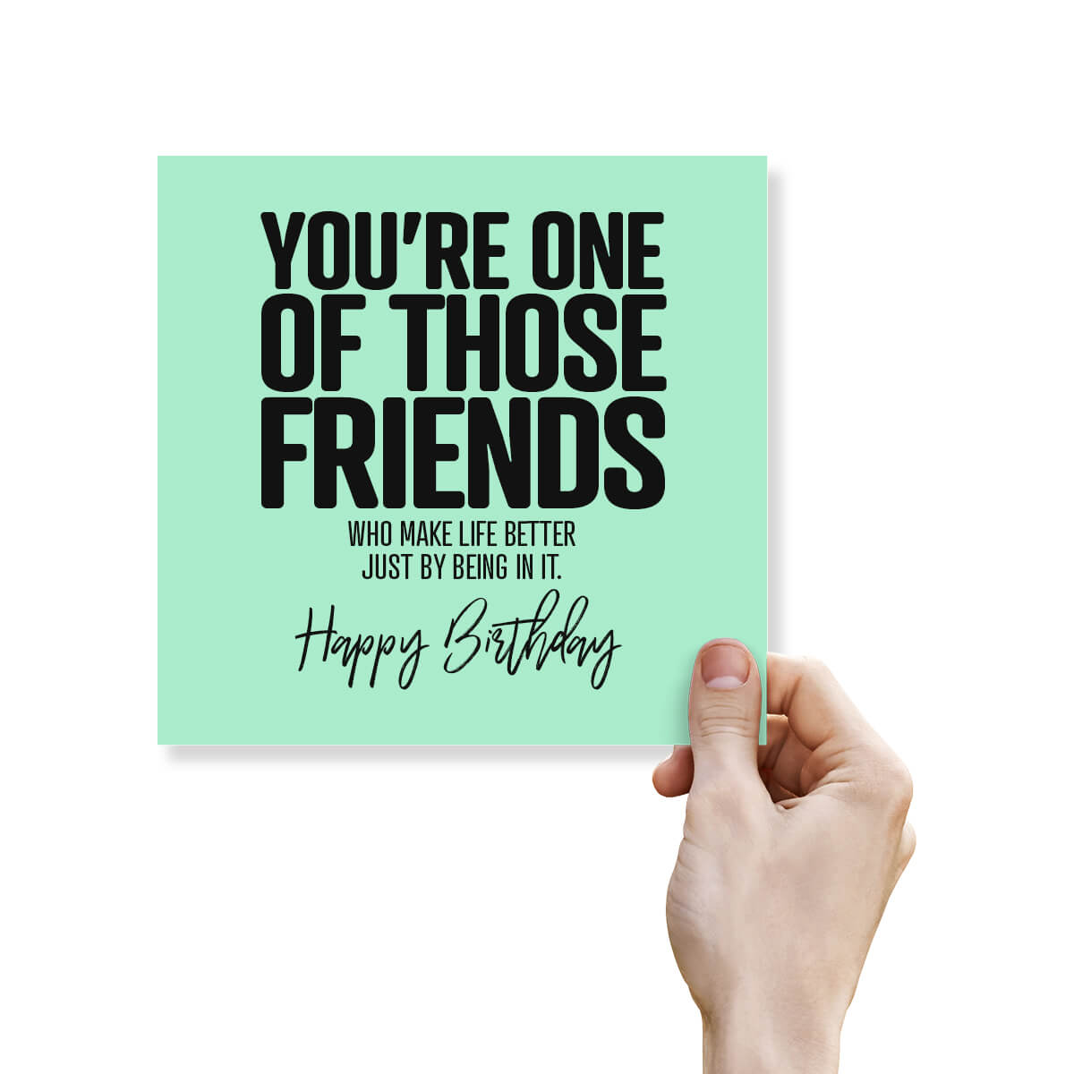 Hand holding a birthday card with a motivational message on a white background