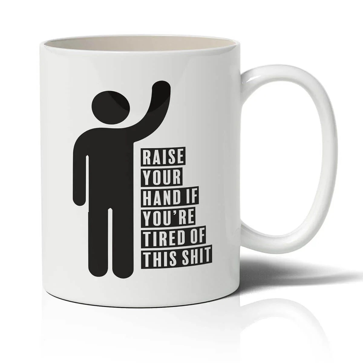 White mug with black silhouette and text 'Raise your hand if you're tired of this shit' on a white background