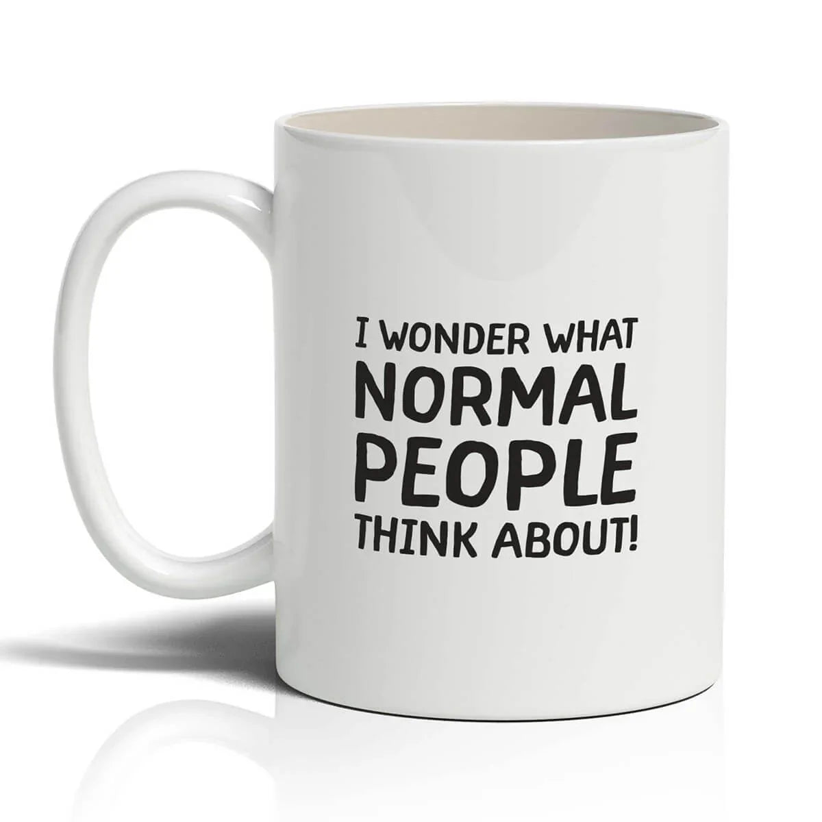 White mug with black text 'I wonder what normal people think about!' on a white background