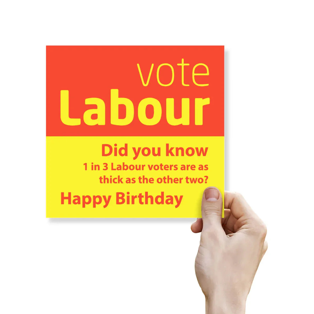 Hand holding a card with 'vote Labour' text on a red and yellow background