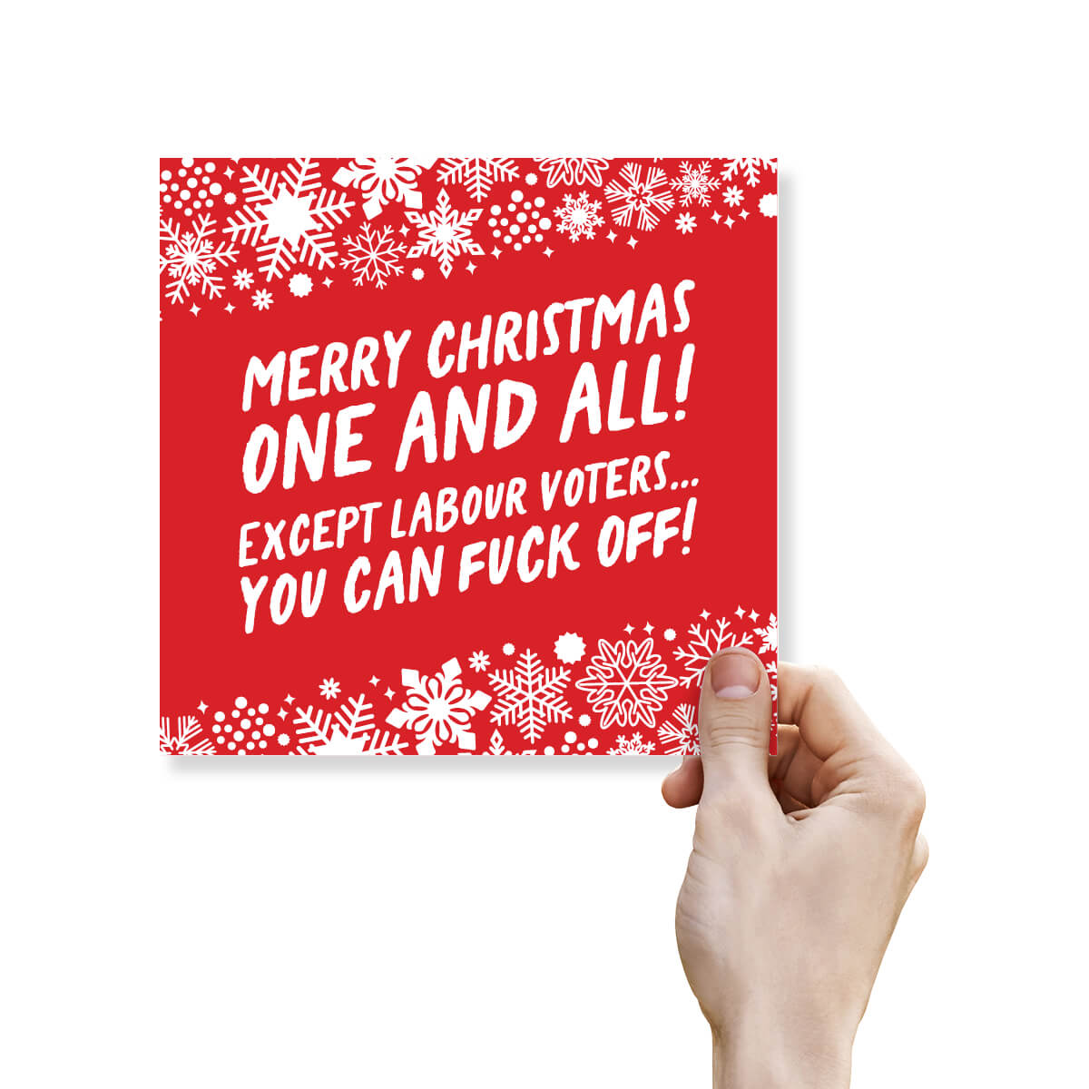 Red Christmas card with white text and snowflakes, held by a hand.
