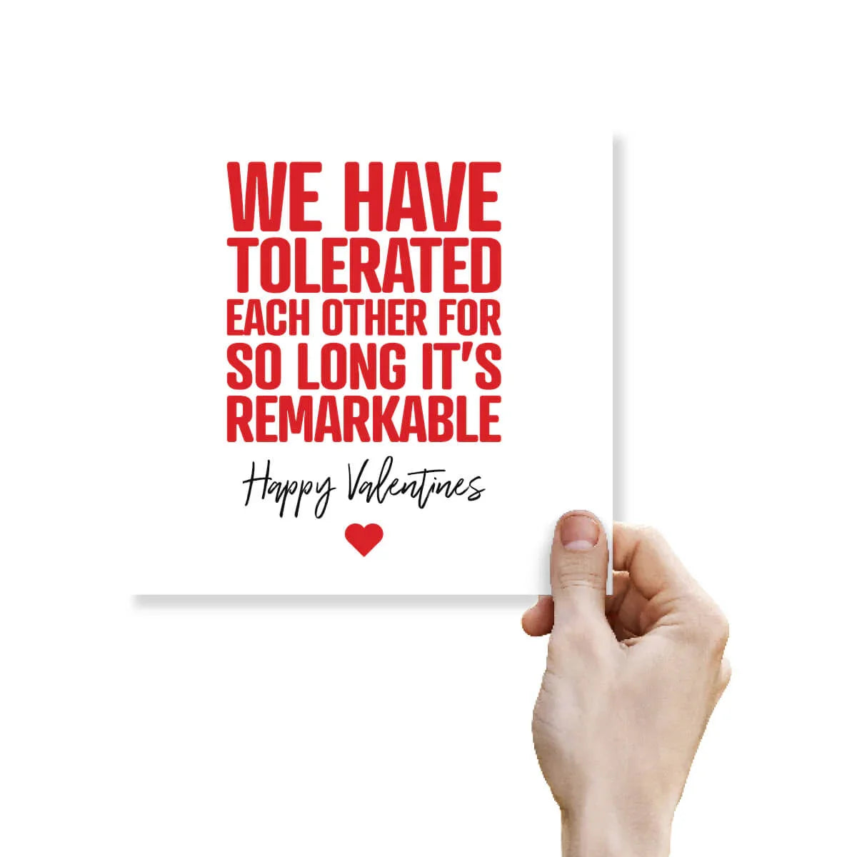Funny Valentine's Day card with bold red text, held by a hand, lighthearted greeting