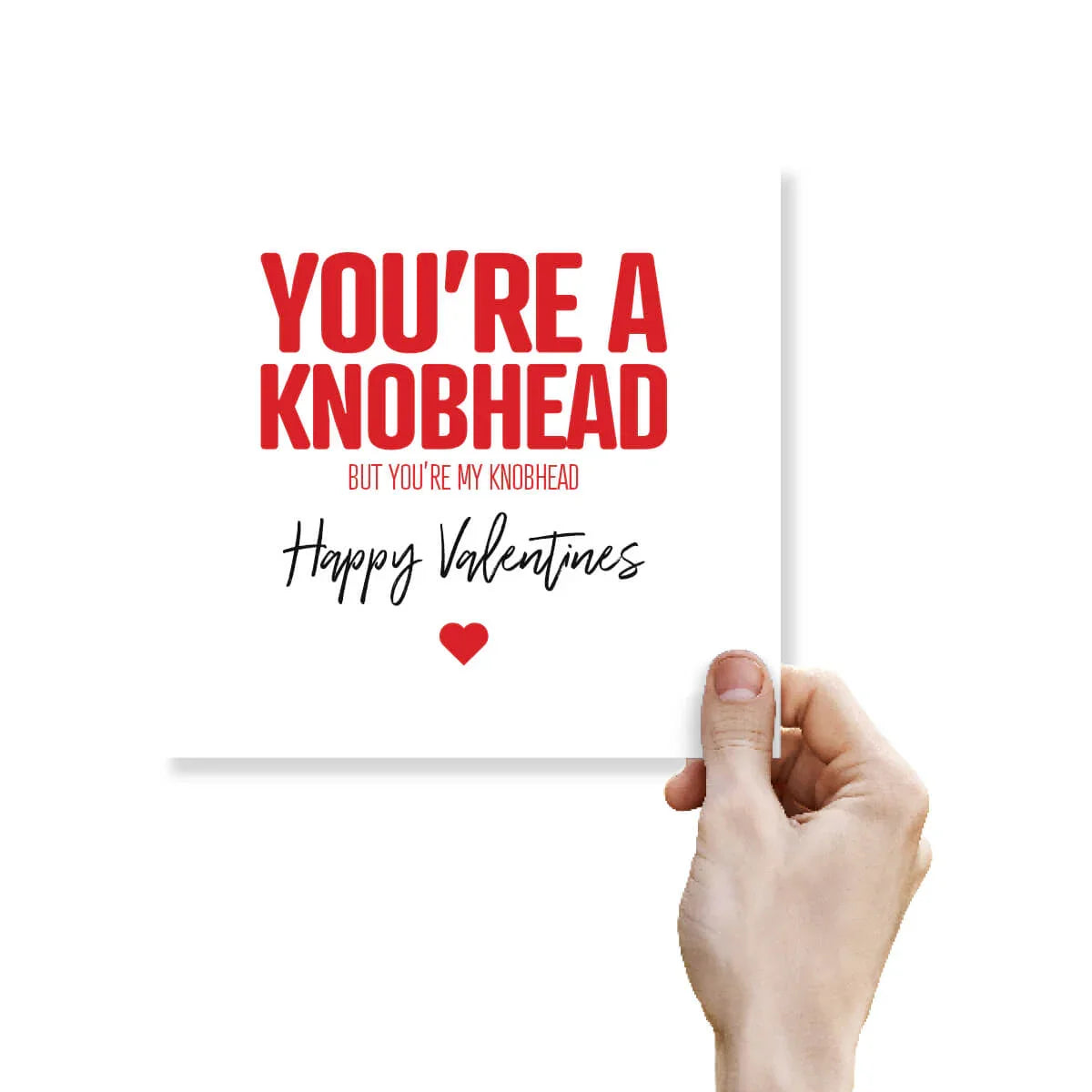 Funny rude Valentine's Day card with the text 'You're a knobhead' held by a hand on white background.