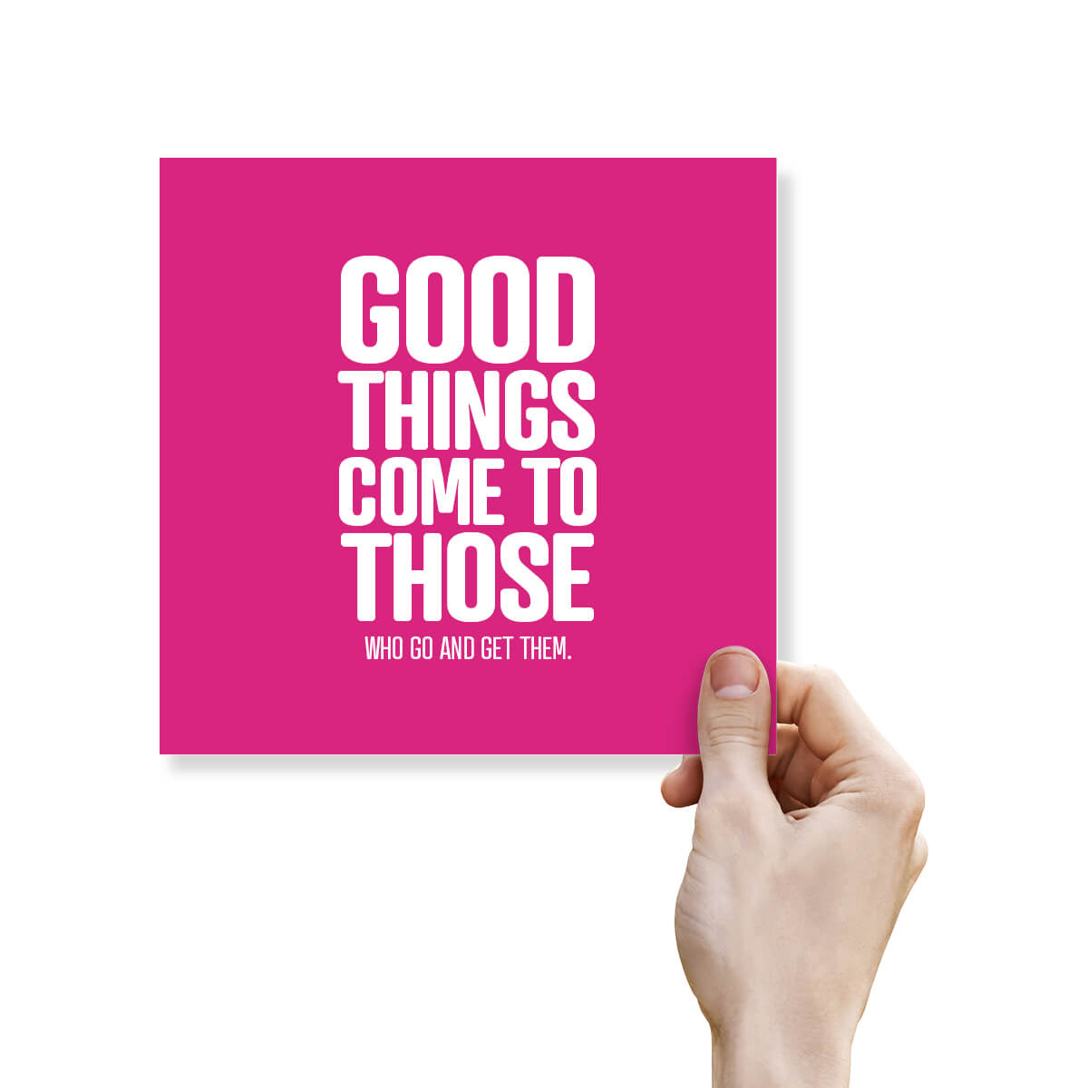 Hand holding a pink card with motivational text on a white background