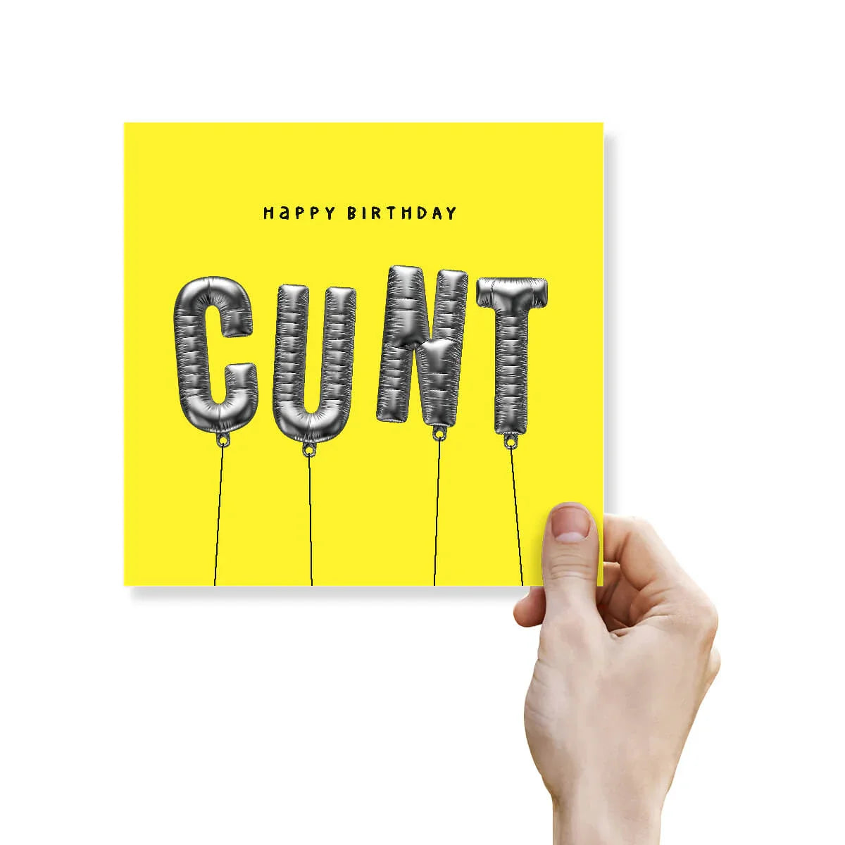 Hand holding a yellow birthday card with 'Happy Birthday CUNT' text on a white background