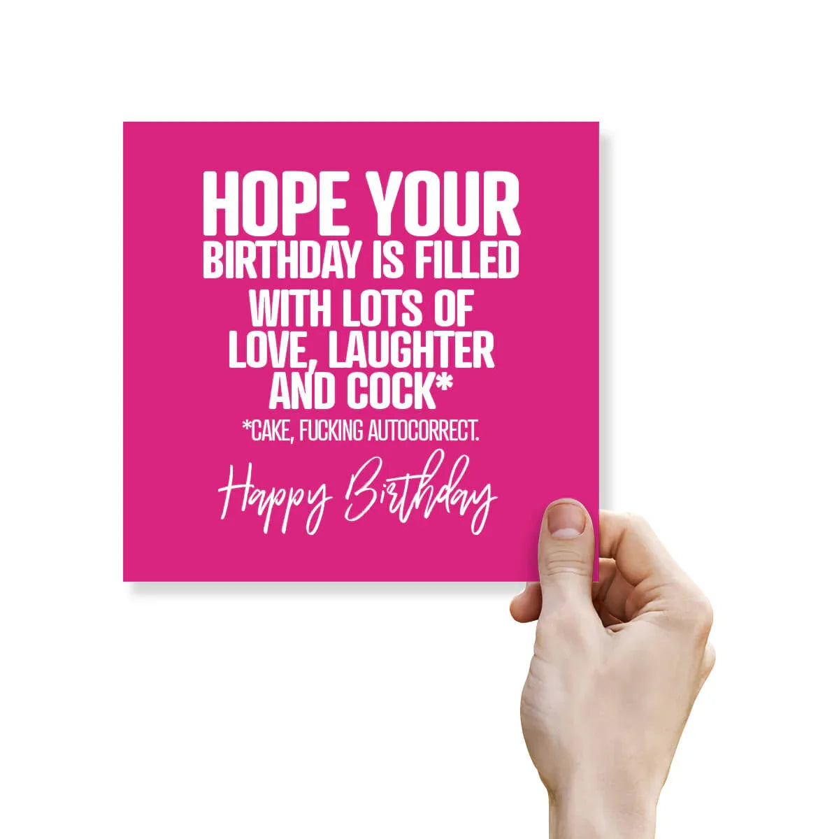 Pink birthday card with humorous text held by a hand on a white background