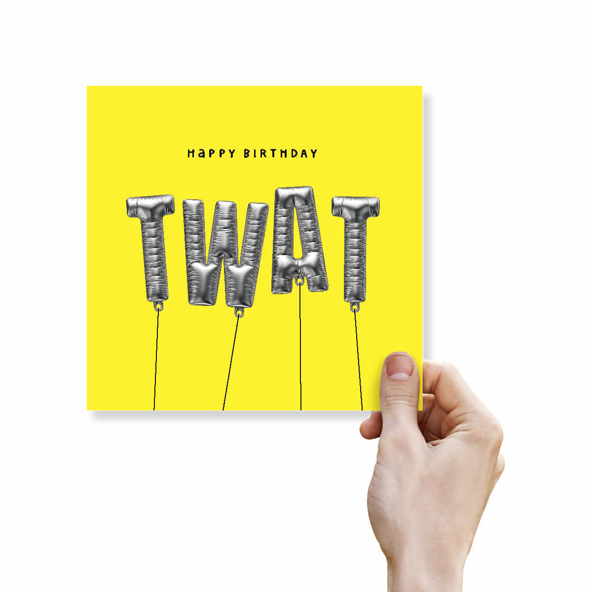 A hand holding a bright yellow square greeting card that reads 'HAPPY BIRTHDAY' above metallic silver balloon-style letters spelling 'TWAT' on a white background.
