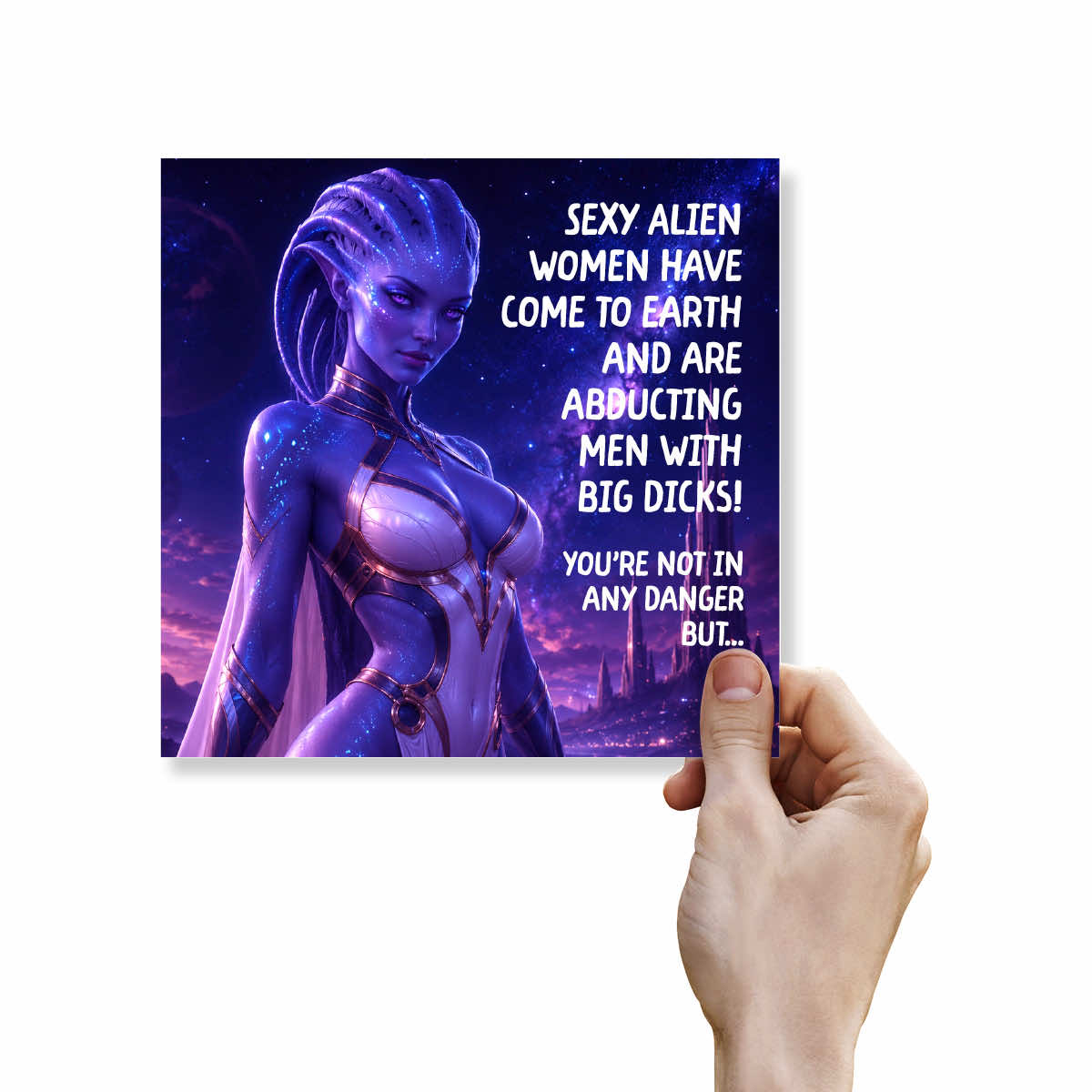 A hand holding a square printed card or poster featuring a stylized purple alien woman on the left and bold white text on the right, shown against a plain white background.