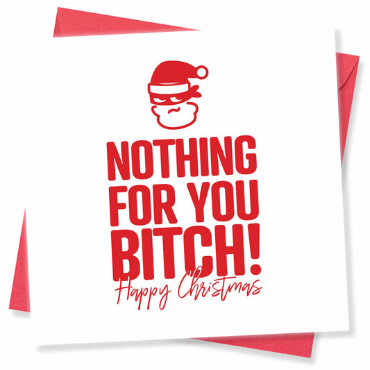 A square white Christmas greeting card with bold red text reading 'NOTHING FOR YOU BITCH!' and a small red Santa face graphic above, with 'Happy Christmas' in red script below. Red envelopes are partially visible behind the card on a white background.