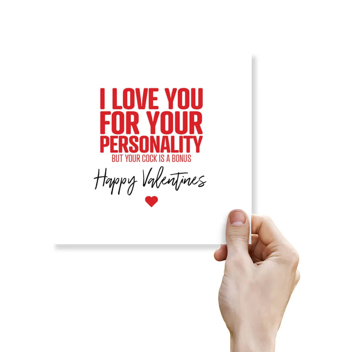 Hand holding rude funny Valentine's Day card with bold red text and heart on white background