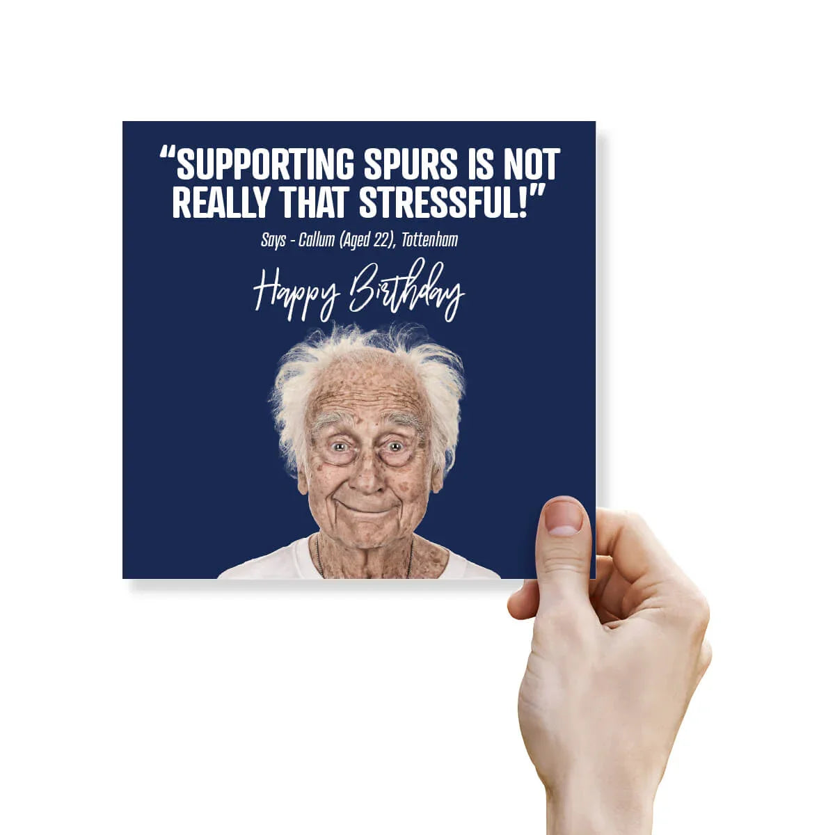 Hand holding a birthday card with an elderly man's face and humorous text on a blue background.