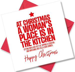 funny christmas card saying At Christmas A Woman’s Place Is In The Kitchen Sitting With Her Feet Up, Sipping A Cocktail And Watching Her Fella Cook Dinner.