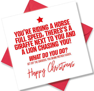 rude christmas card saying You’re Riding A Horse full speed There’s A Girafffe Next To You And A Lion Chasing You! What Do You do? Get Off The Caraousel You Drunk Mother Fucker